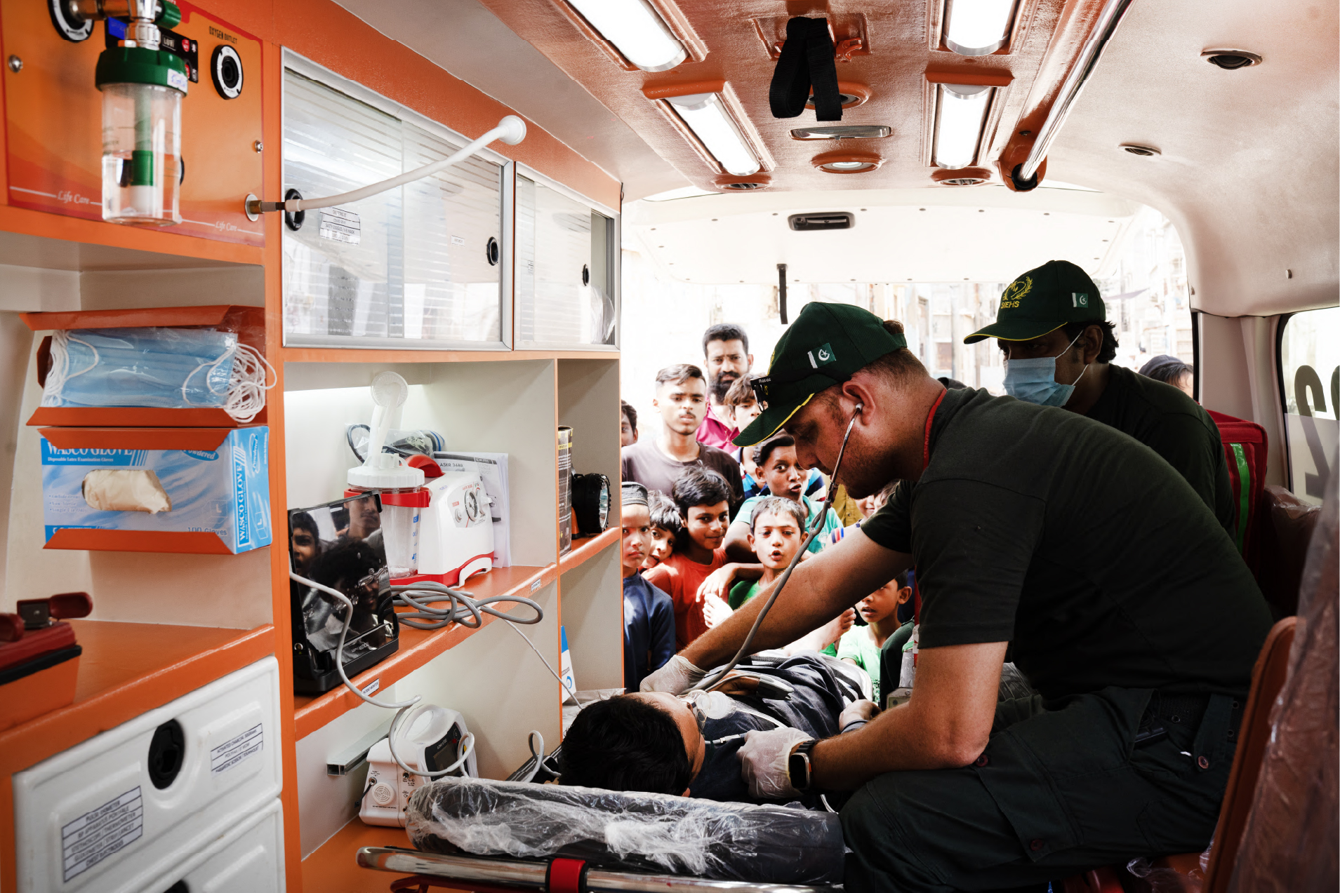SIEHS 1122 paramedic assessing a patient inside a free ambulance in Karachi